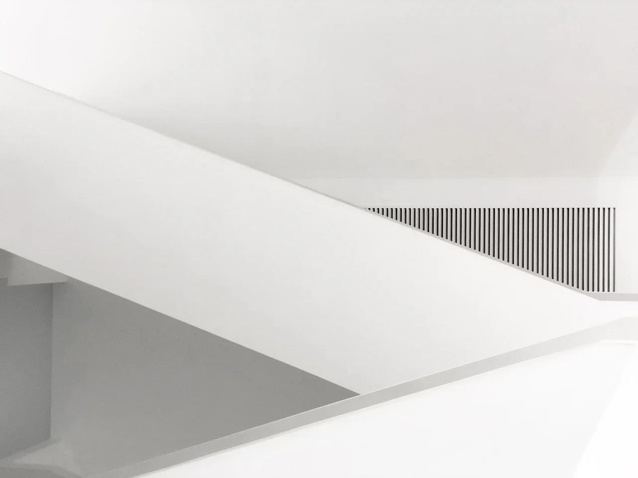 Modern geometric interior highlighting light, shadow, and architectural discipline