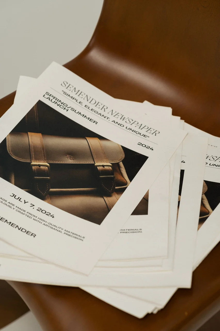 Editorial broadsheet newspaper format featuring bespoke luxury goods advertising