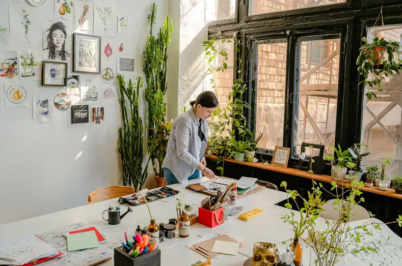 Designer crafting colour palettes and visual systems with focused attention
