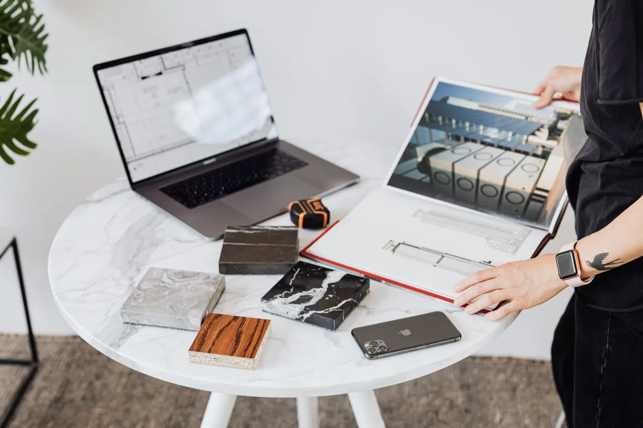 Editorial planning desk with typography sheets and design layouts