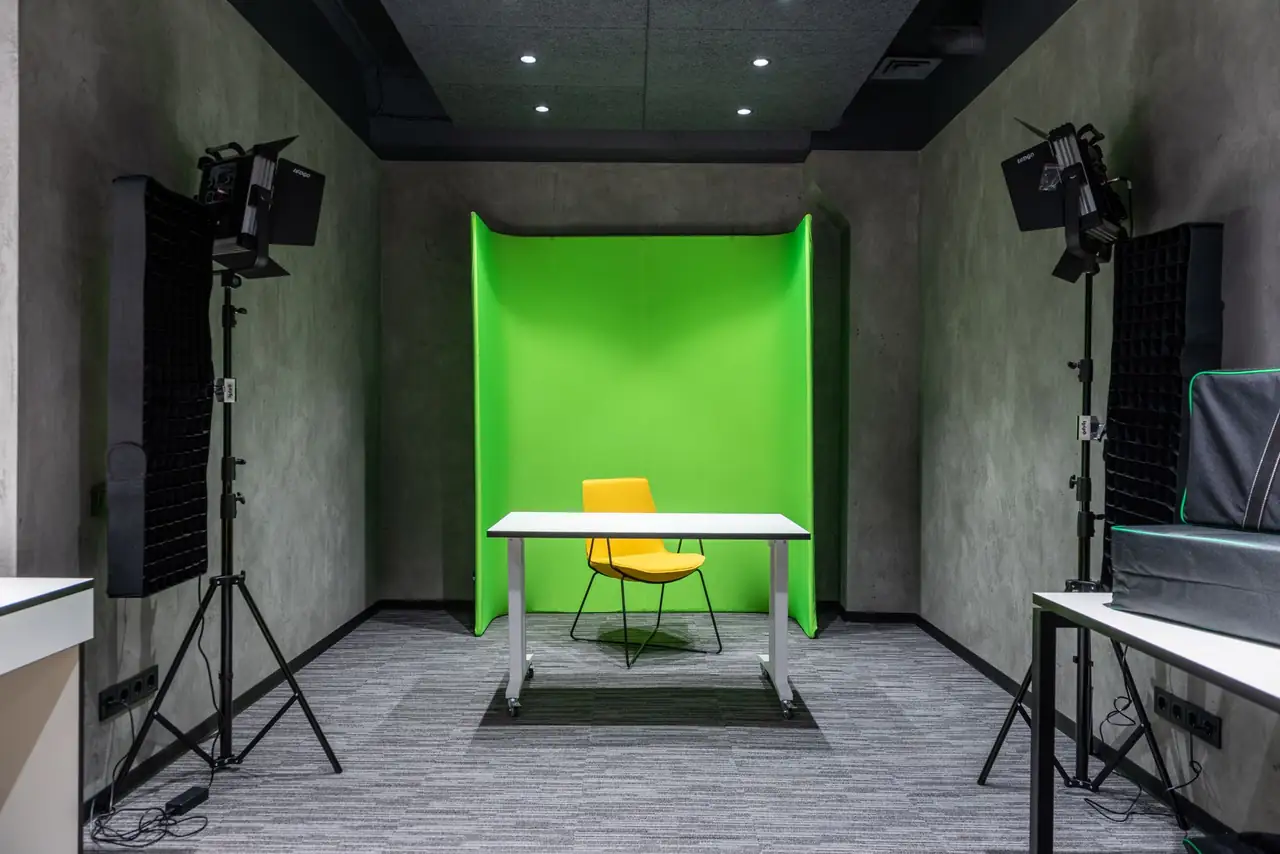 Architectural chair in gallery setting with subtle olive green backdrop