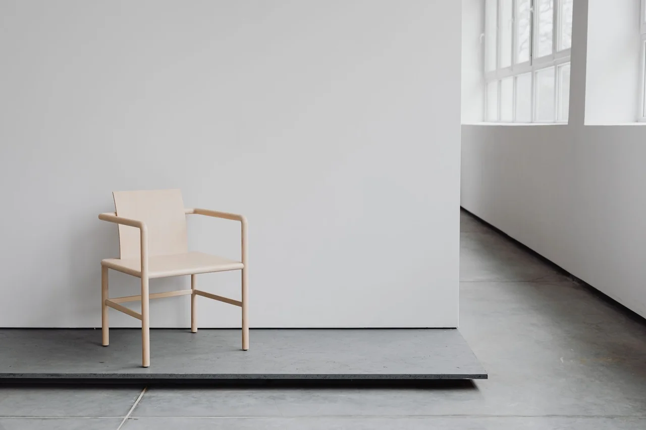 Minimalist architectural chair and stone interior for boutique hospitality