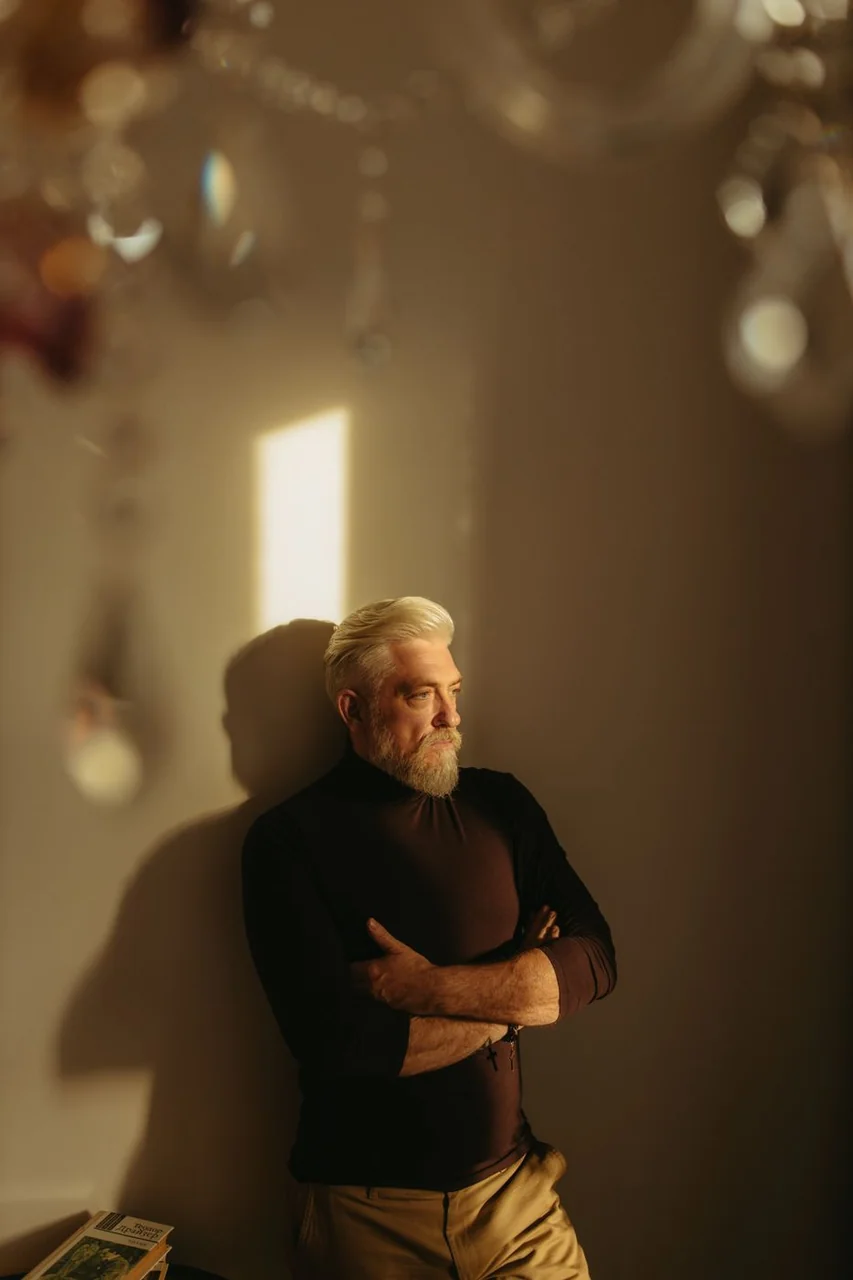 Agency director in British studio attire reflecting disciplined creative leadership
