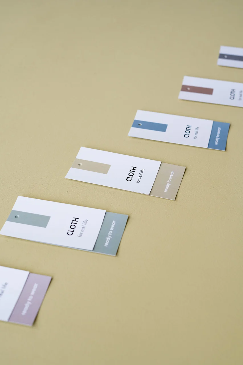 Flat lay of sustainable paper labels and organic branding collateral